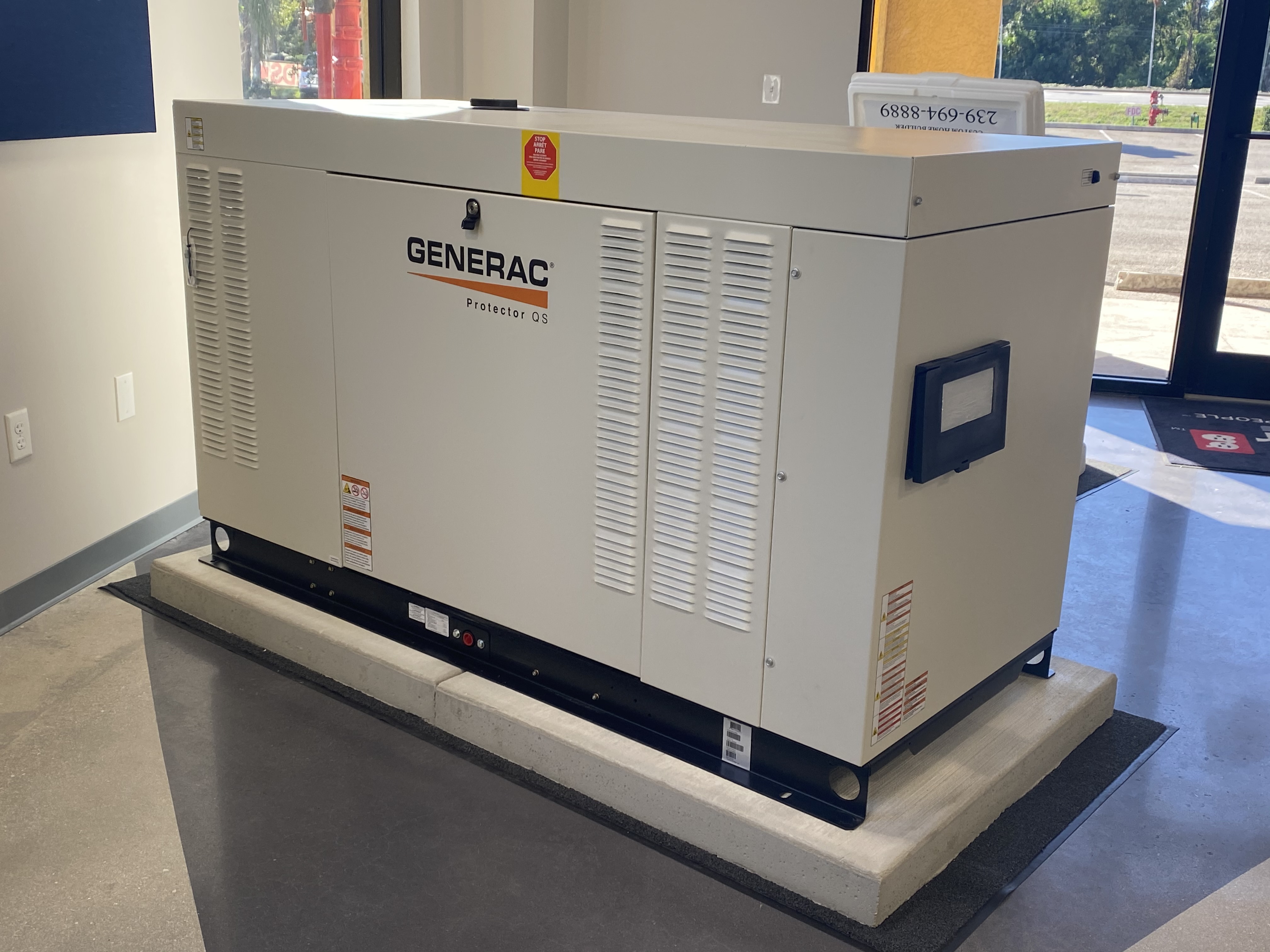 Liquid-cooled generator installed on precast concrete pads