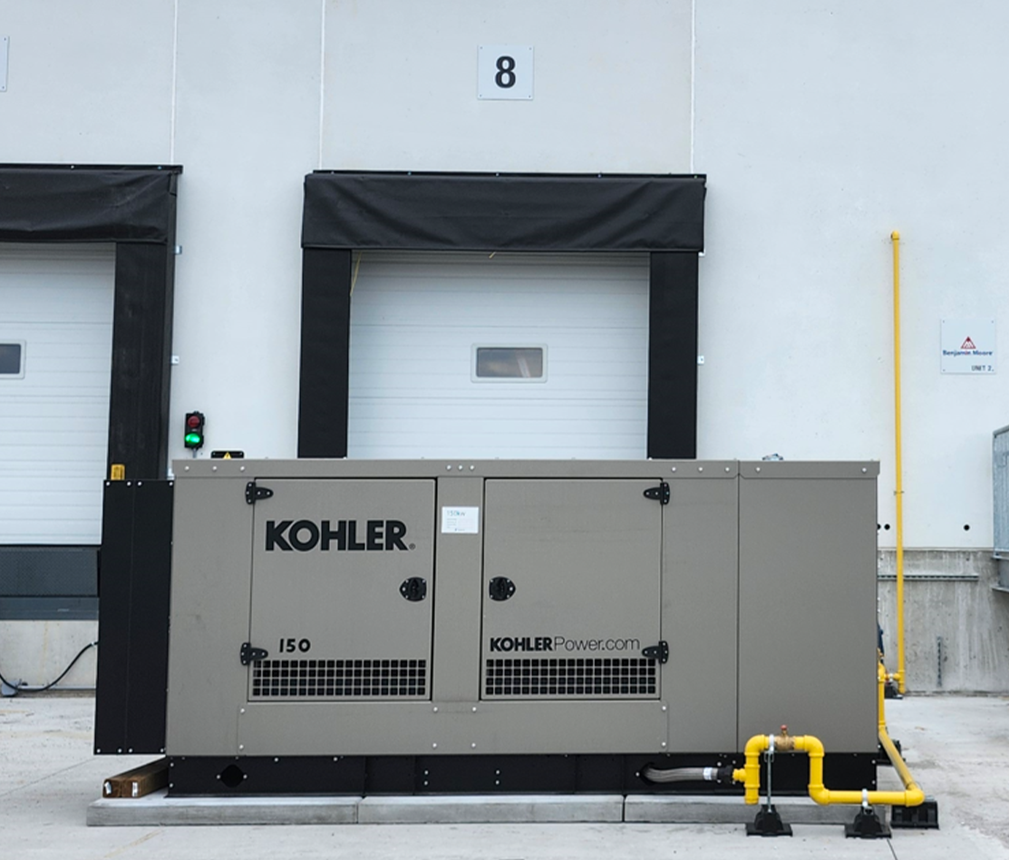 Triple precast pad set installed under a large liquid-cooled generator