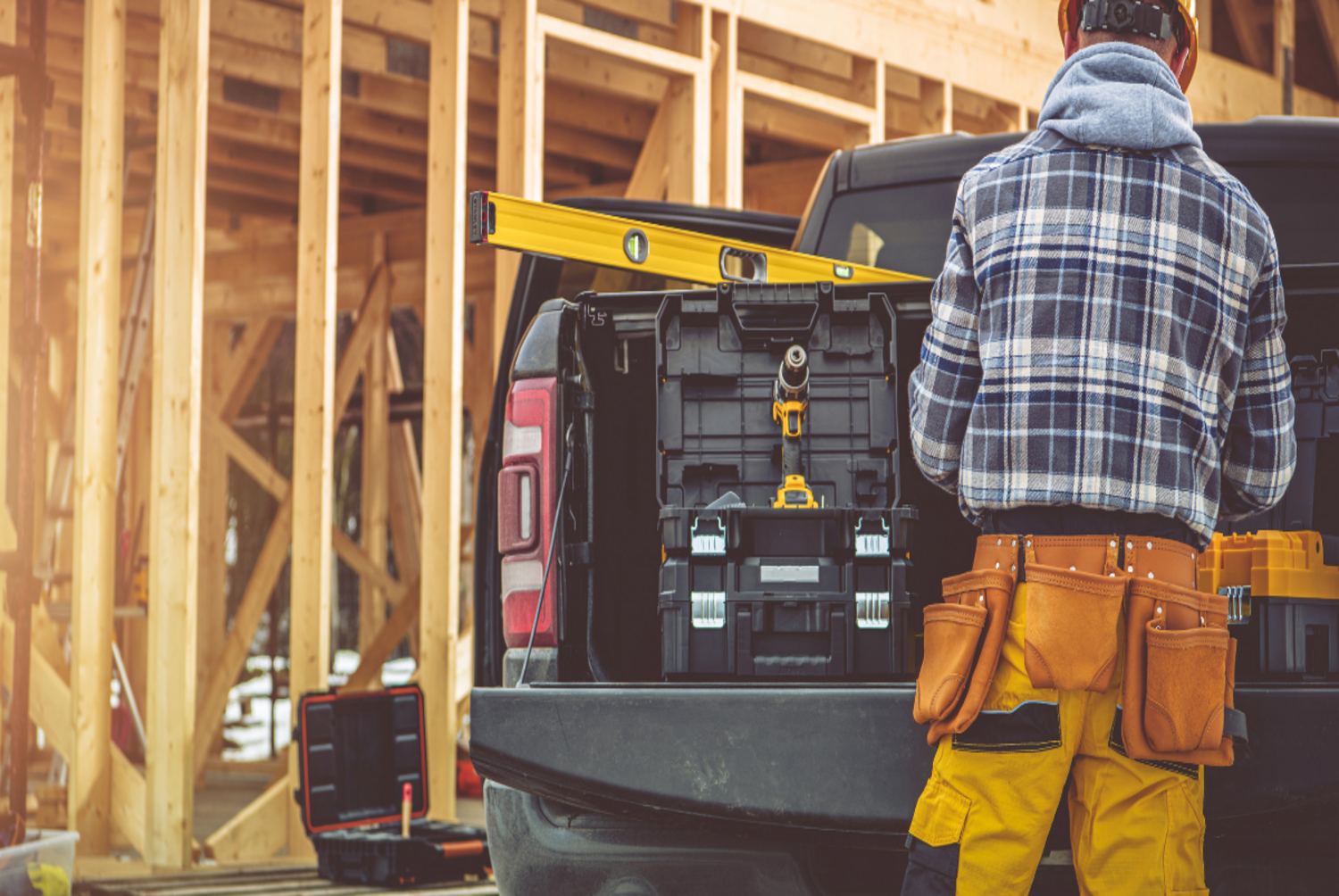 contractor taking something from his pickup truck