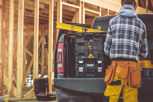 contractor taking something from his pickup truck
