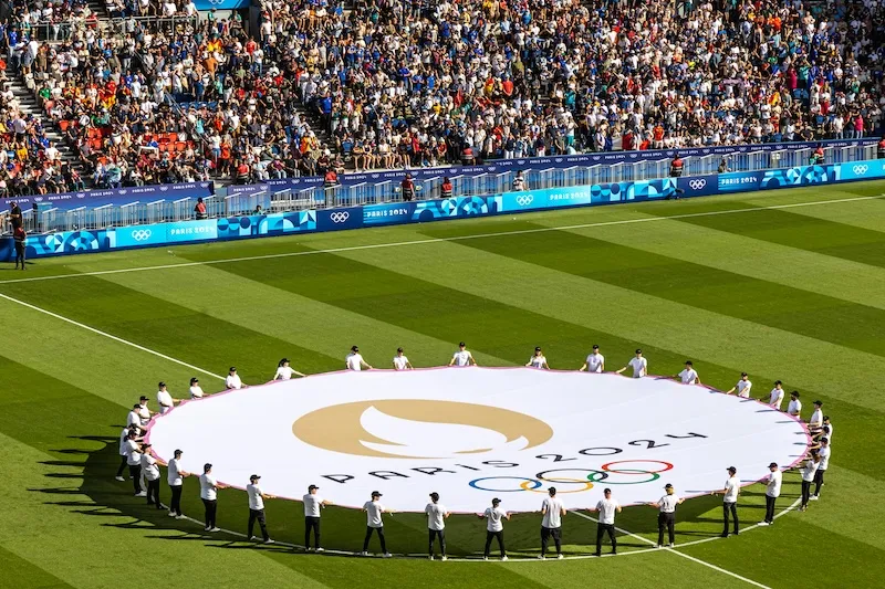 Kick-off Paris 2024 logo on the soccer field