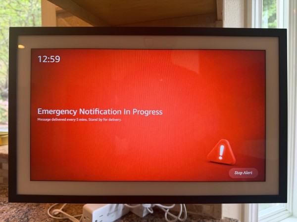 An Alexa device displaying an emergency alert message.