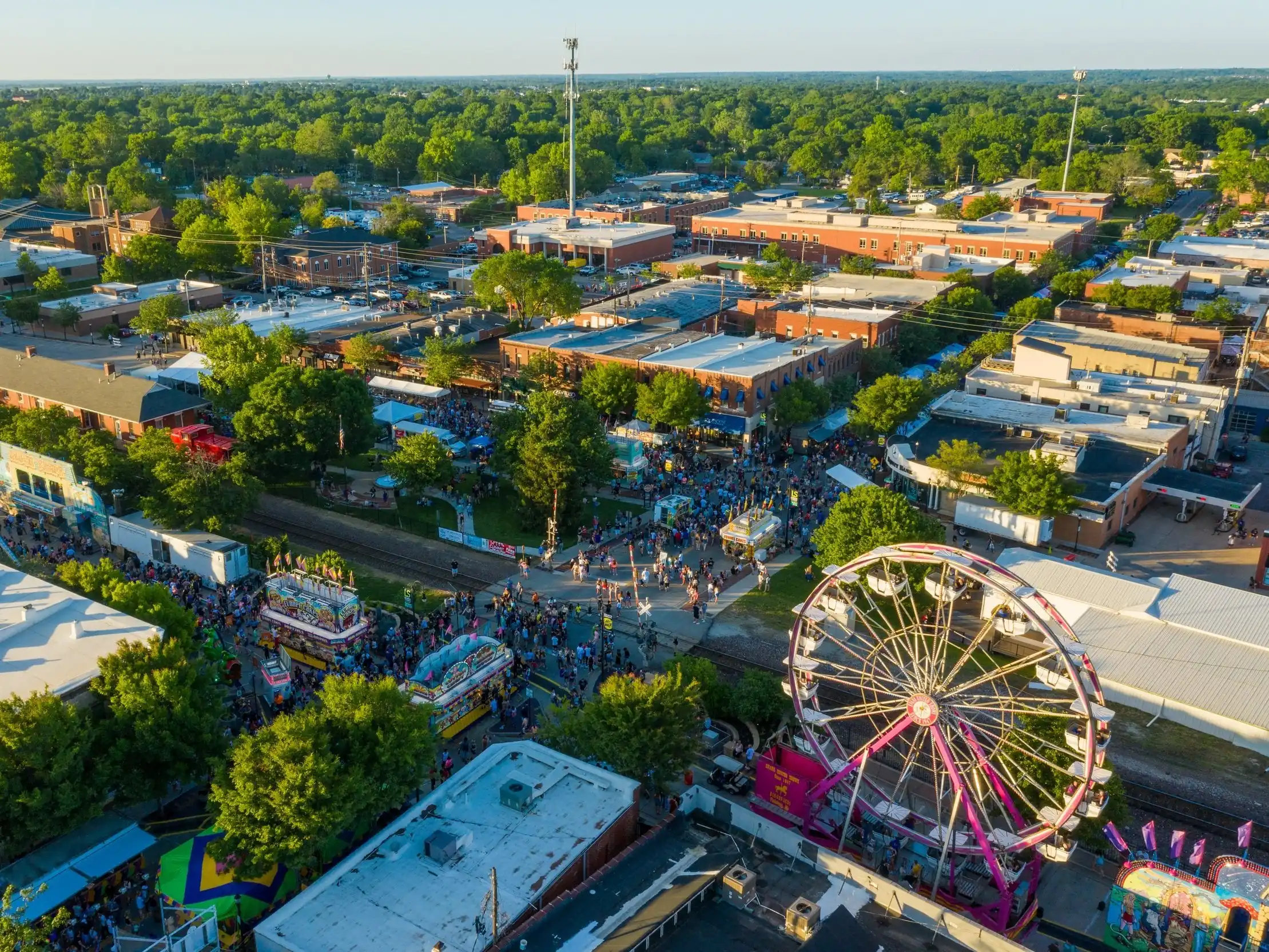 High angle shot of downtown Lee's Summit with ferris wheel and crowds.