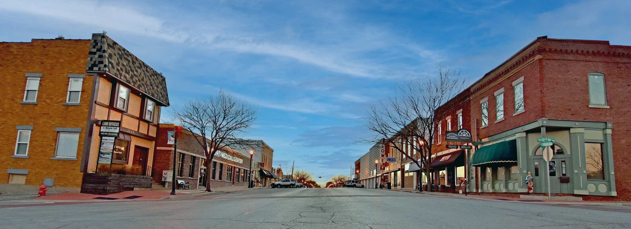 Blue Springs, MO downtown main road with red brick buildings on each side.