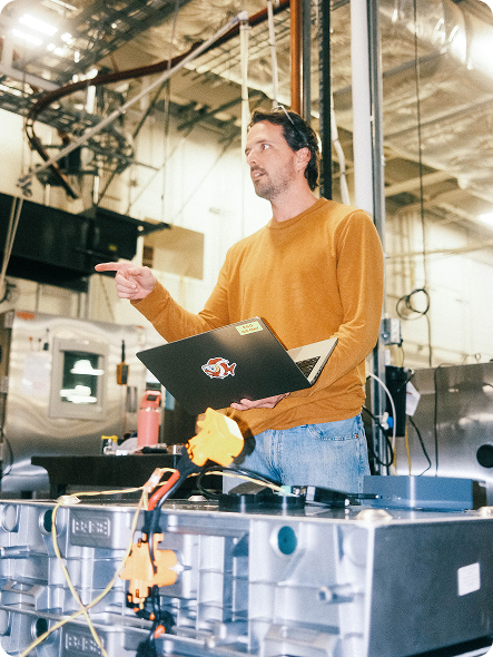 Man with a laptop in a warehouse