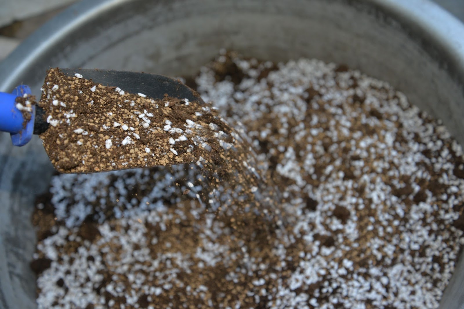 Best soil for autoflowers being mixed in a bucket