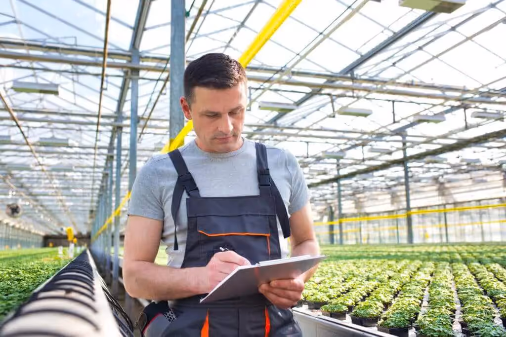 Grower taking crop registration notes