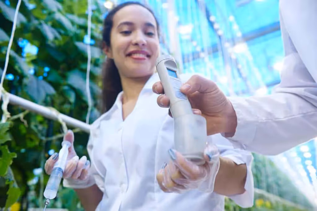 Woman grower testing the soil EC