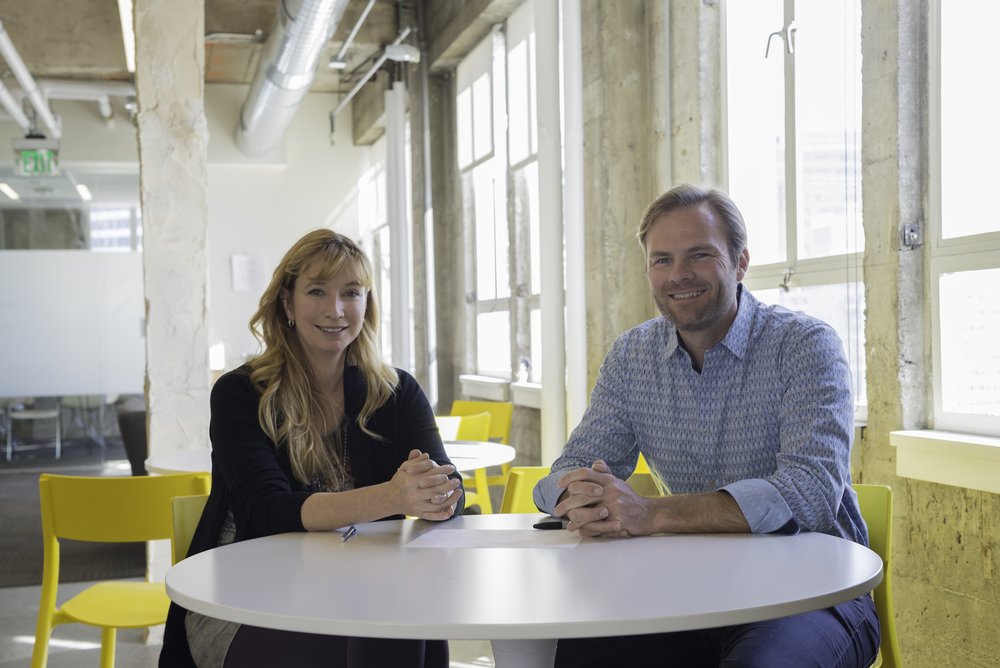 aKin team poses with Minister Ed Husic, with companies robot in centre