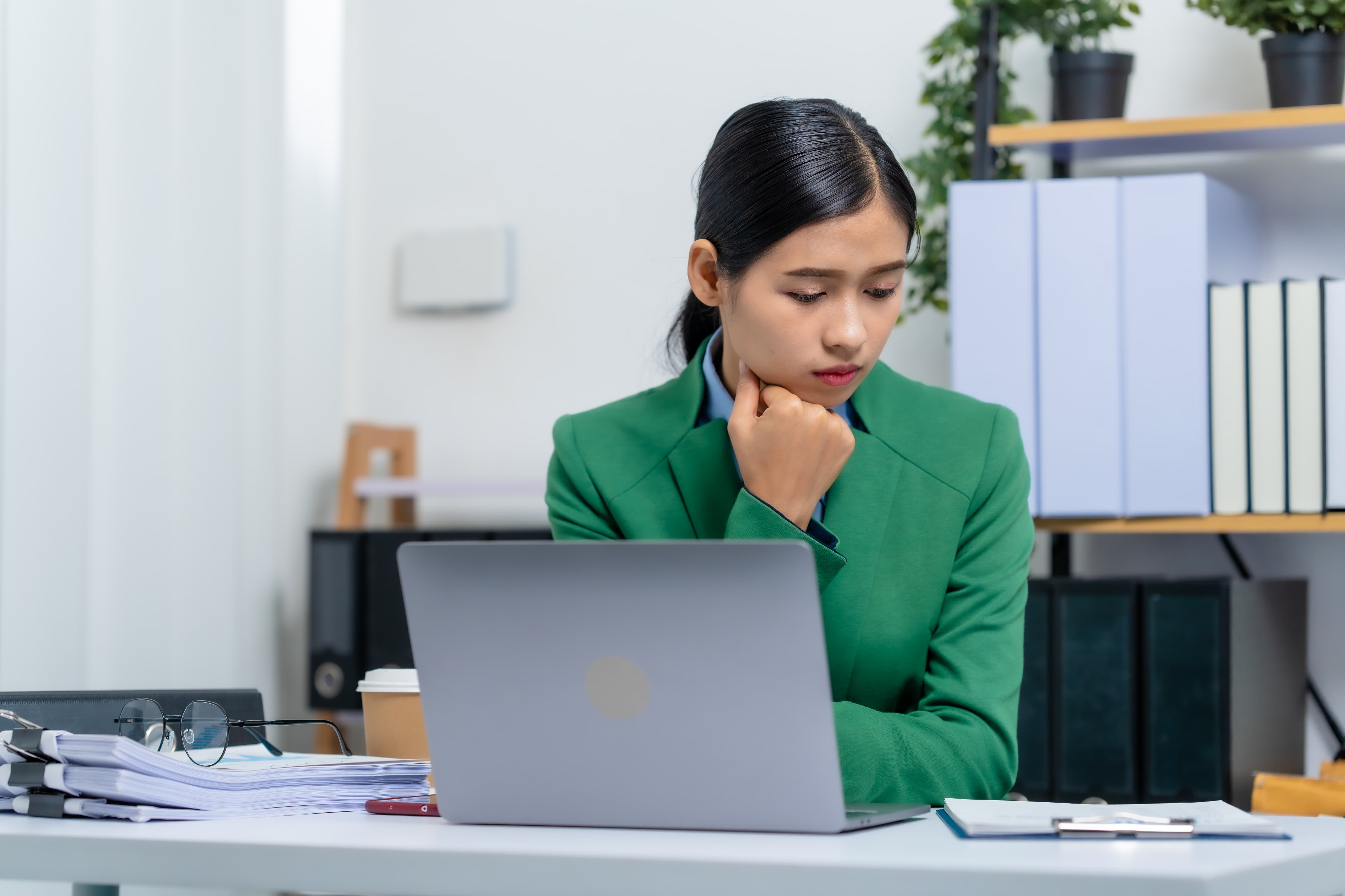 Young busy asian business woman manager, lawyer doing bookkeeping audit graph documents checking Bank Reconciliation, Base Stock, Last Invoice Price, Freight, Drop Product or Drop Section Decisions