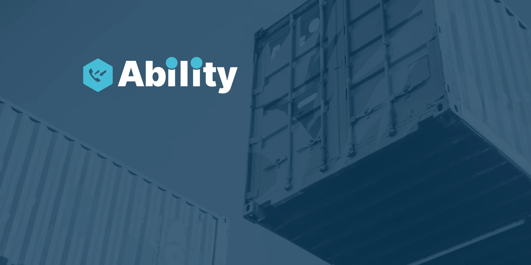 Two large shipping containers with a hexagon logo and the word Ability on blue background.