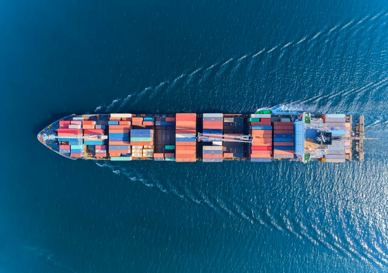 A cargo ship from above in the sea.