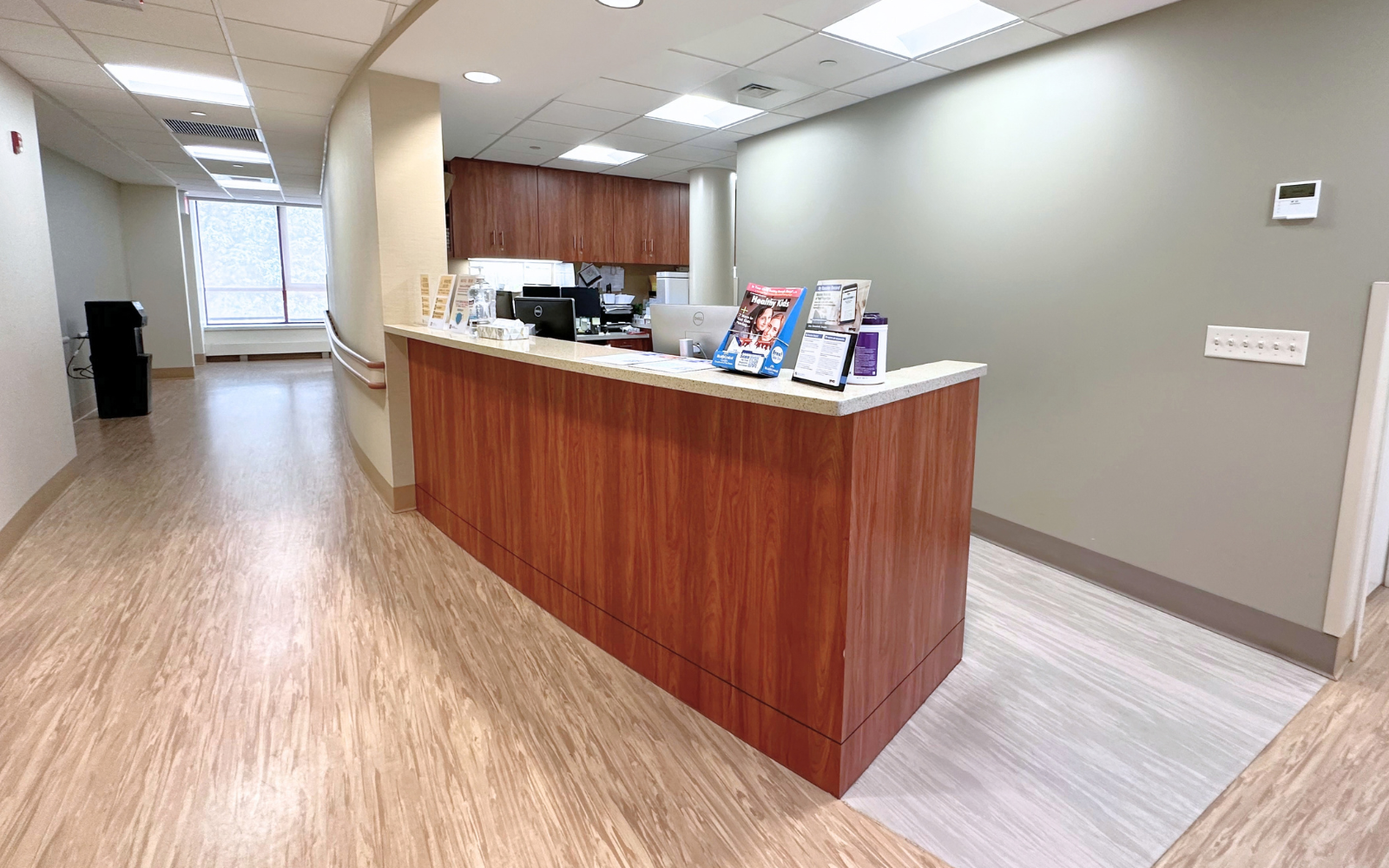 a wooden counter sitting in the middle of a room