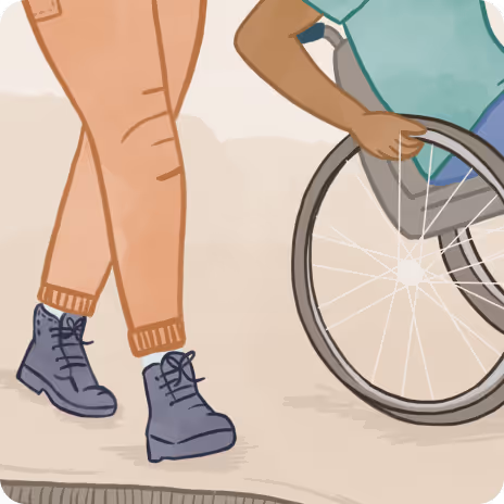 Two people together, one person walking alongside another in a wheelchair
