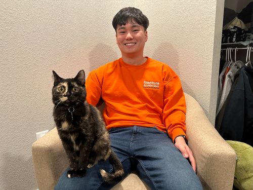 A photo with Nathan and a cat.