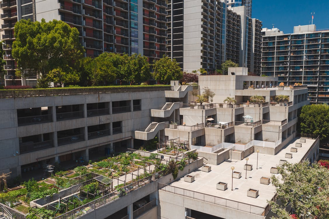aerial view of a rooftop garden on a concrete building near high-rise apartments in Los Angeles