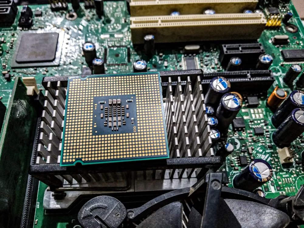 close-up view of a CPU on a motherboard showing its electronic components and circuitry