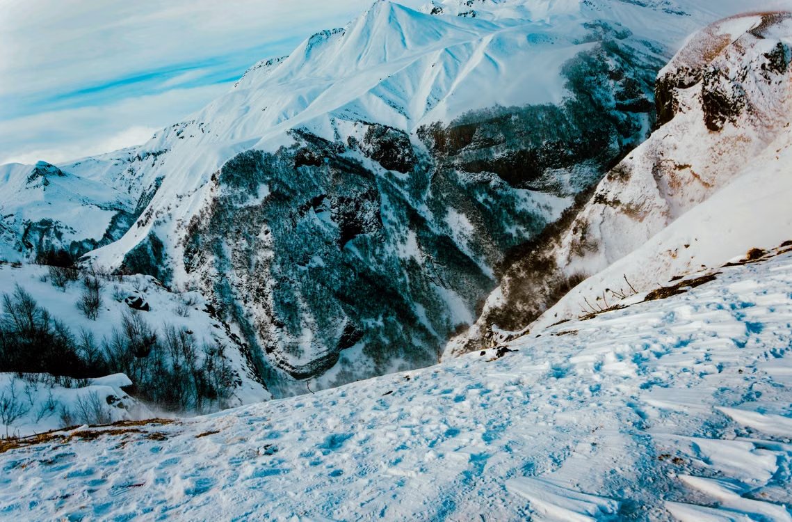 stunning view of snow-covered mountains in winter