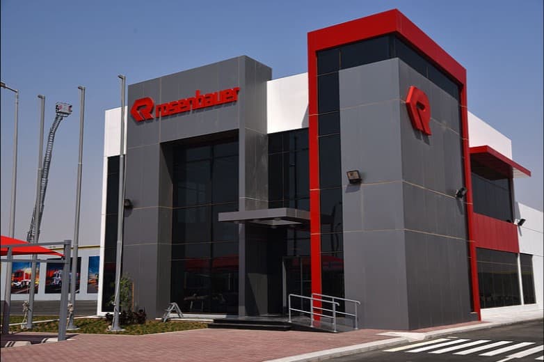 Rosenbauer fire truck factory — 5,000 m² PEB steel structure factory with testing pits and loading bays, KAEC, Saudi Arabia. Delivered by OCC Weavers.