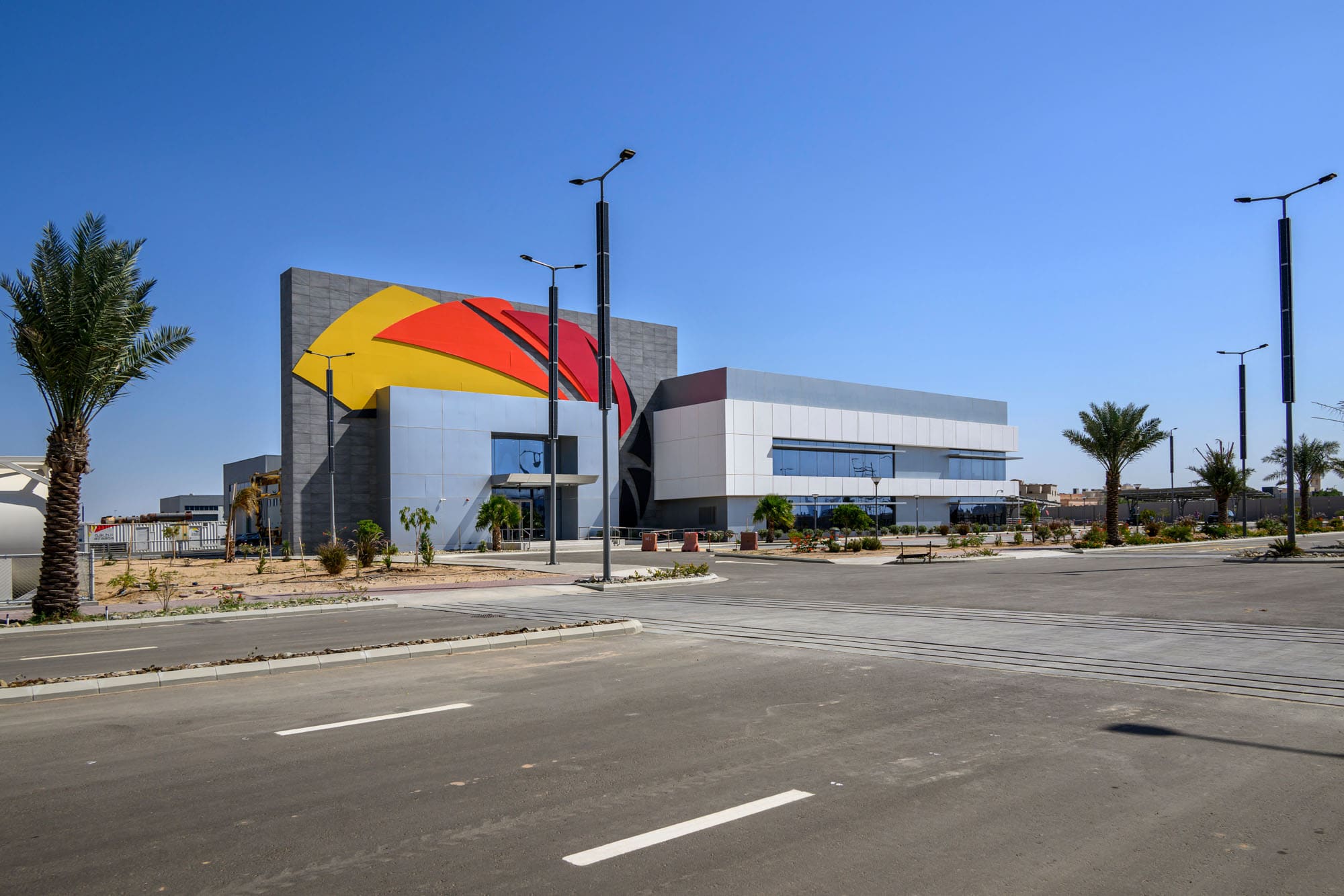 Zahid Business Park Infrastructure and Taqaa — admin buildings, showrooms, 50m water tank landmark and warehouses, Saudi Arabia. Delivered by OCC Weavers.