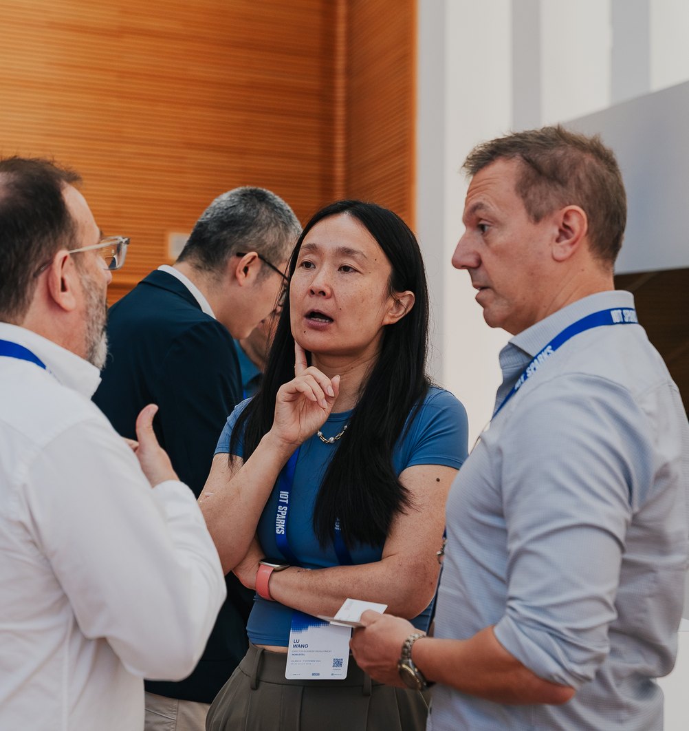 Attendees talking in the exhibition hall at IoT Sparks 2026