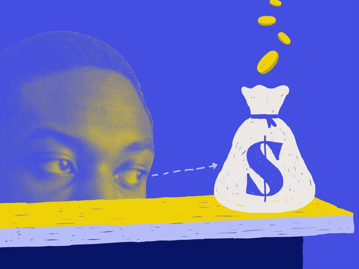 man's upper face with eyes looking at a bag of money