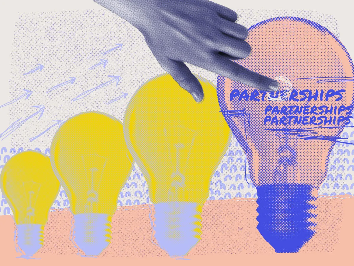 Three colourful graphic lightbulbs with a hand pointing at the word partnerships overlayed on the biggest lightbulbs
