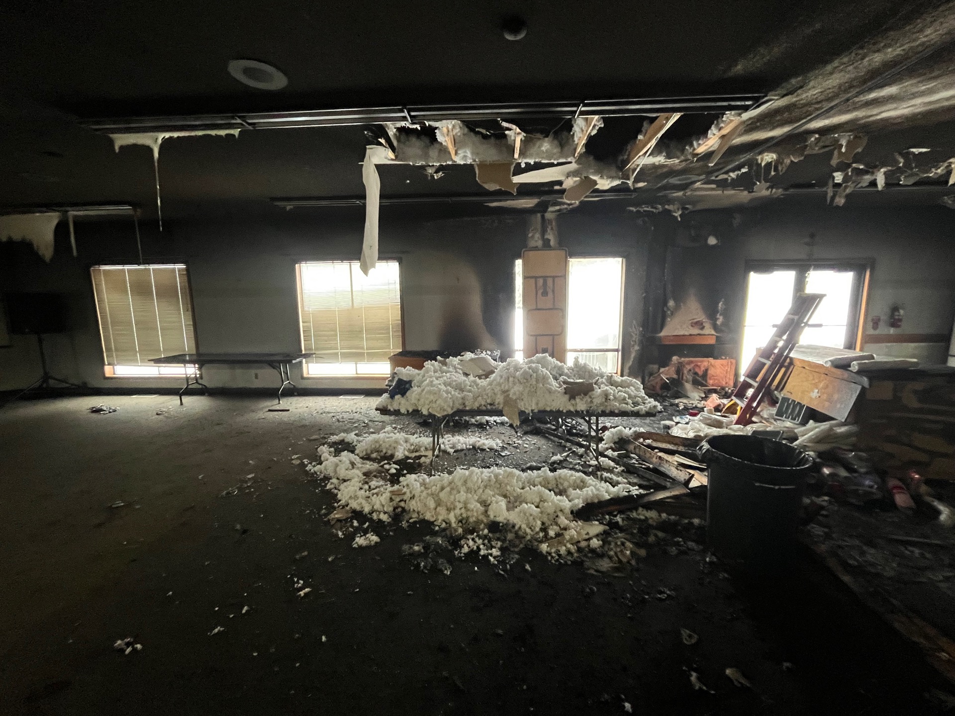 Frozen outdoor faucet covered in frost with an icicle, illustrating winter water damage risks in Walla Walla."