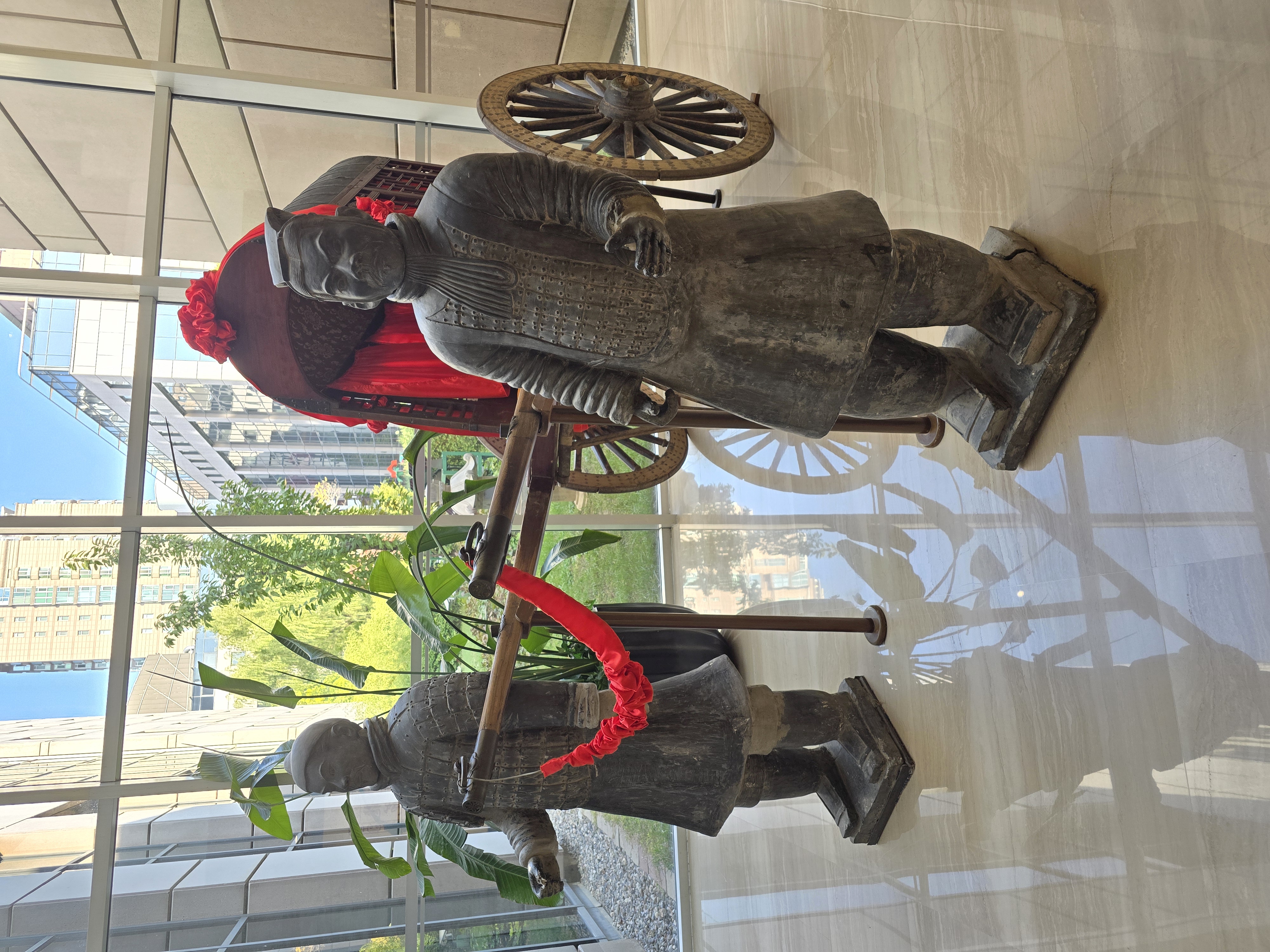 Sculpted figures displayed near the restaurant entrance.