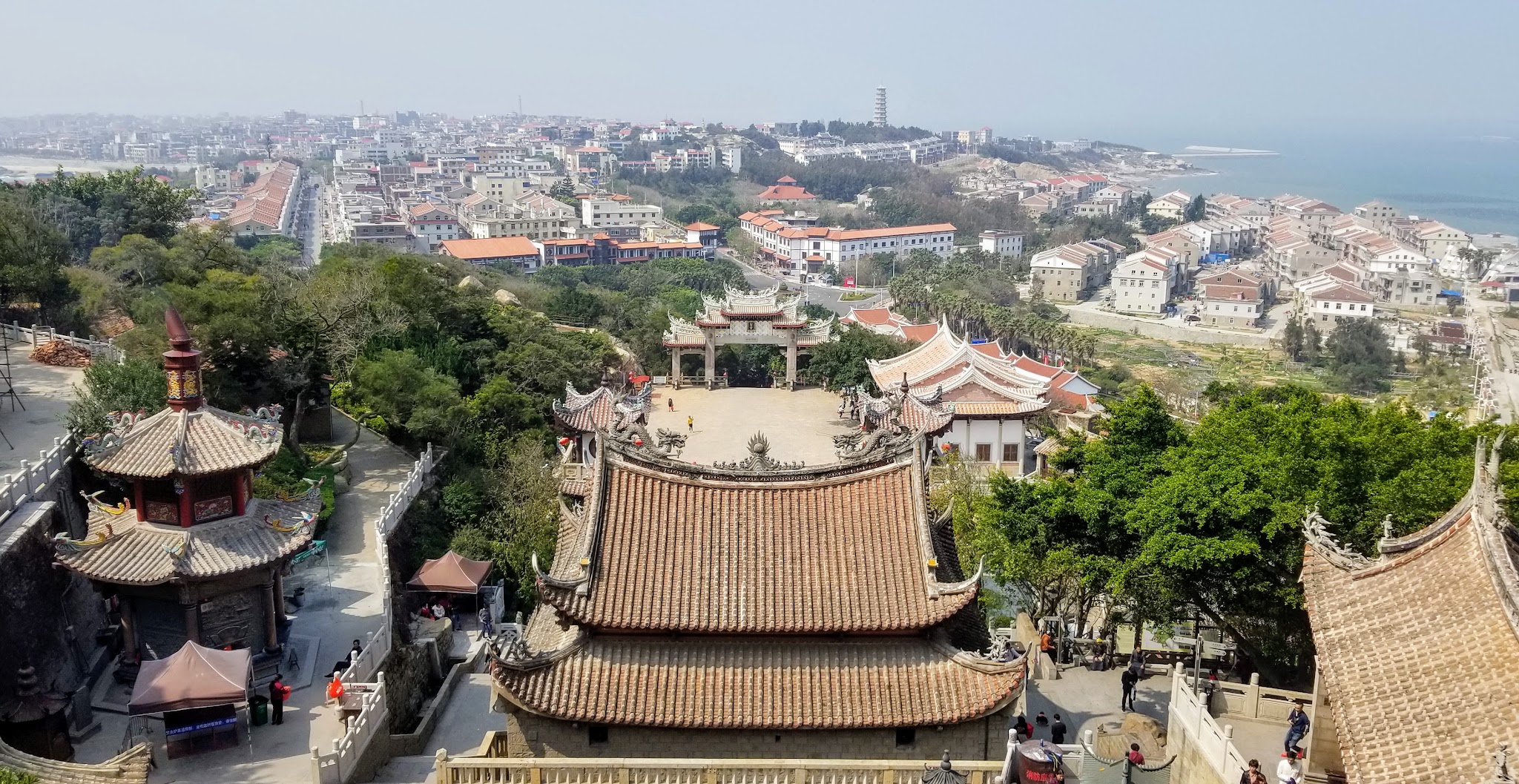 Temple roofs overlooking Meizhou Island and the distant sea