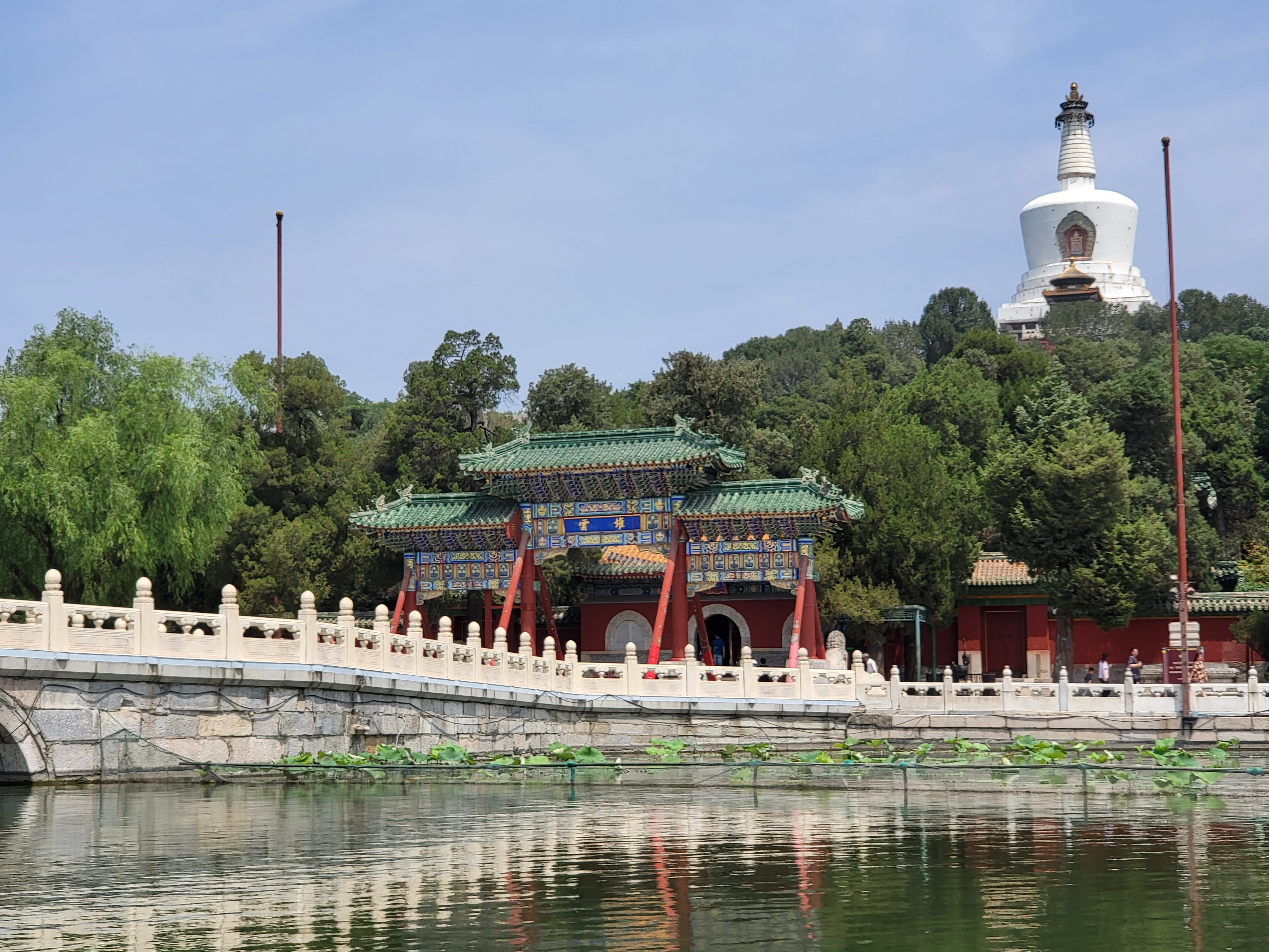 Beihai Park’s White Dagoba rises above the wooded island and lake.