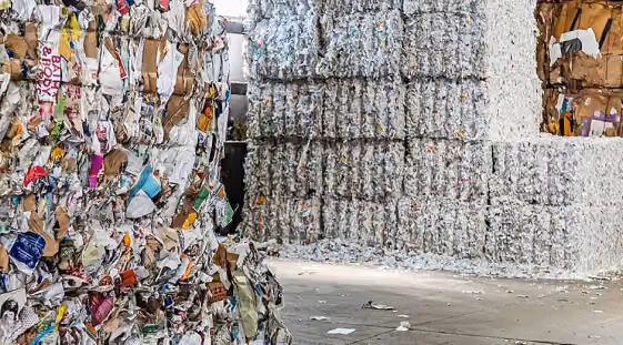 Compressed bales of recycled paper at a recycling facility