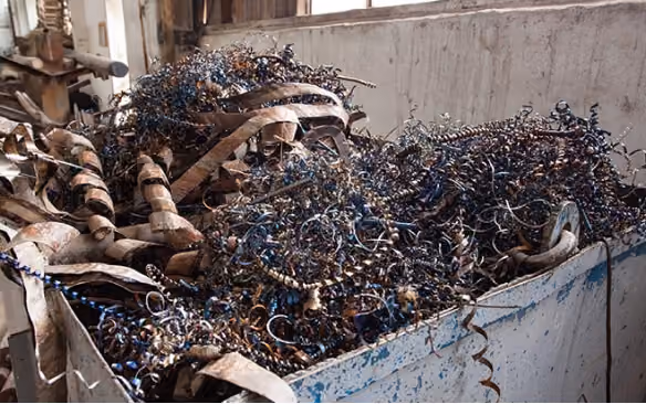 Bin of scrap metal shavings from industrial waste