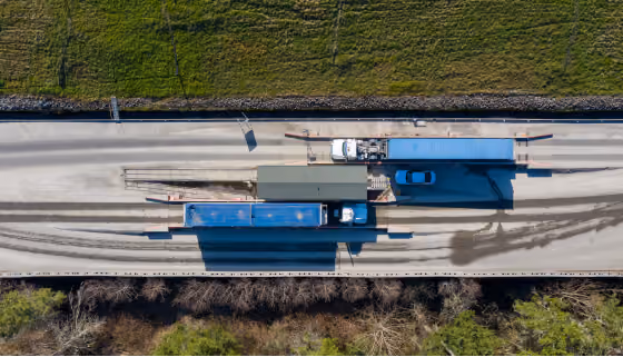 Aerial view of a waste transfer station with containers and trucks
