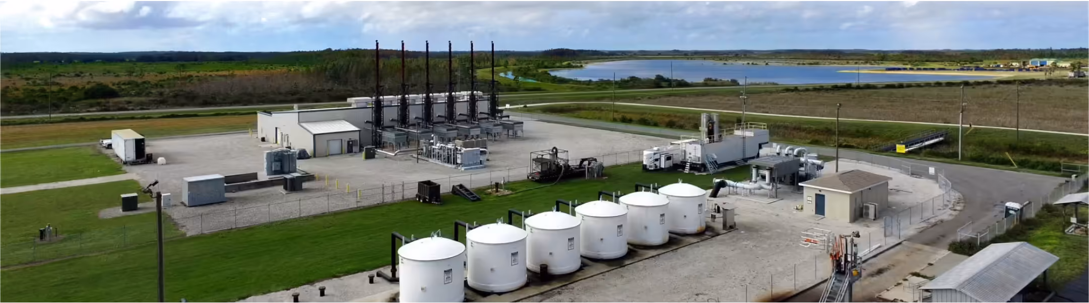 Aerial view of a waste processing facility with storage tanks