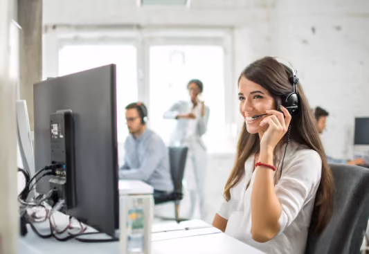 Customer service agent wearing a headset at a call center