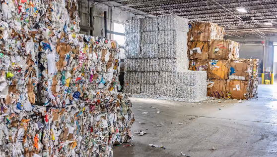 Baled recyclables stacked inside a material recovery facility