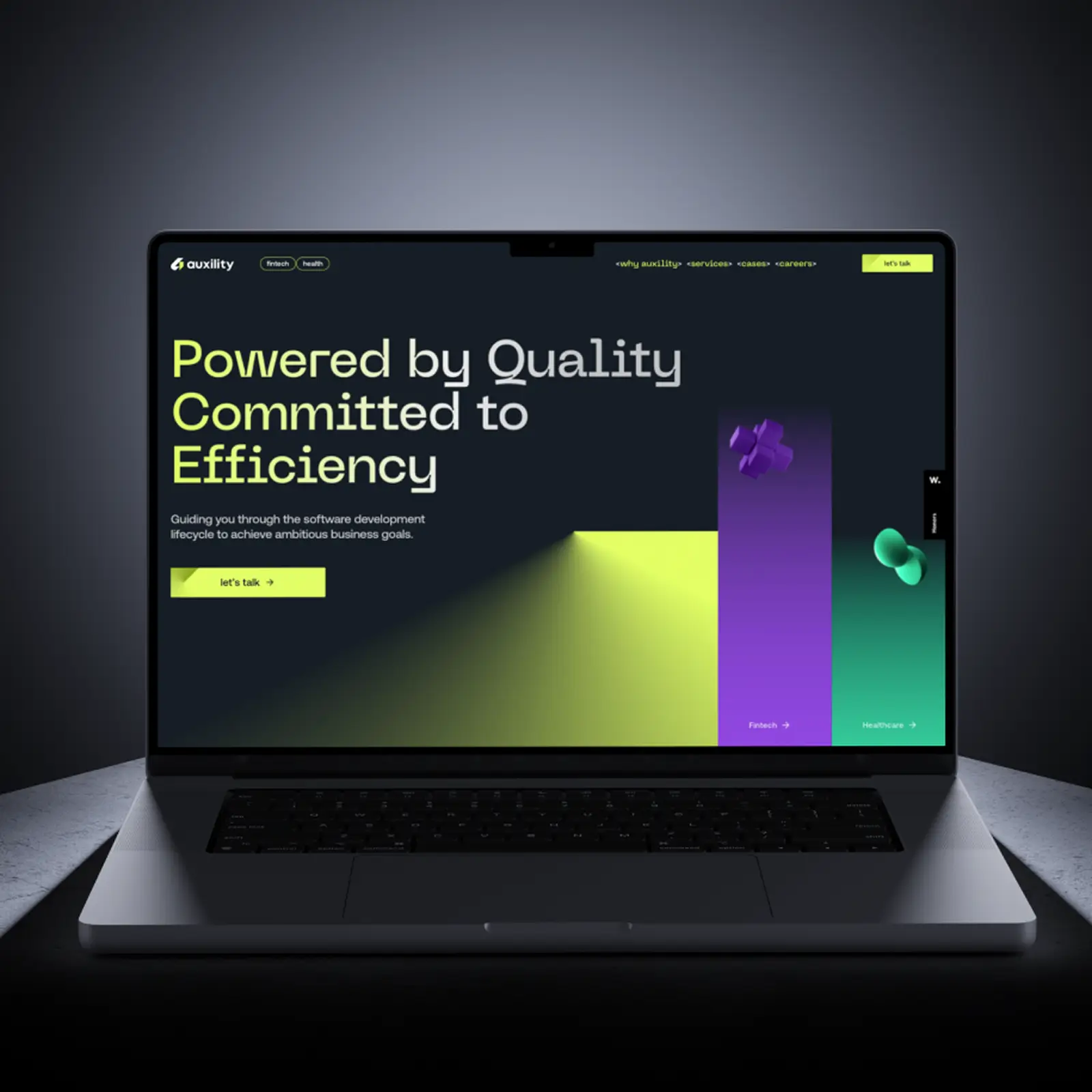 A laptop with a website developed by our team, Auxility, displayed on the screen