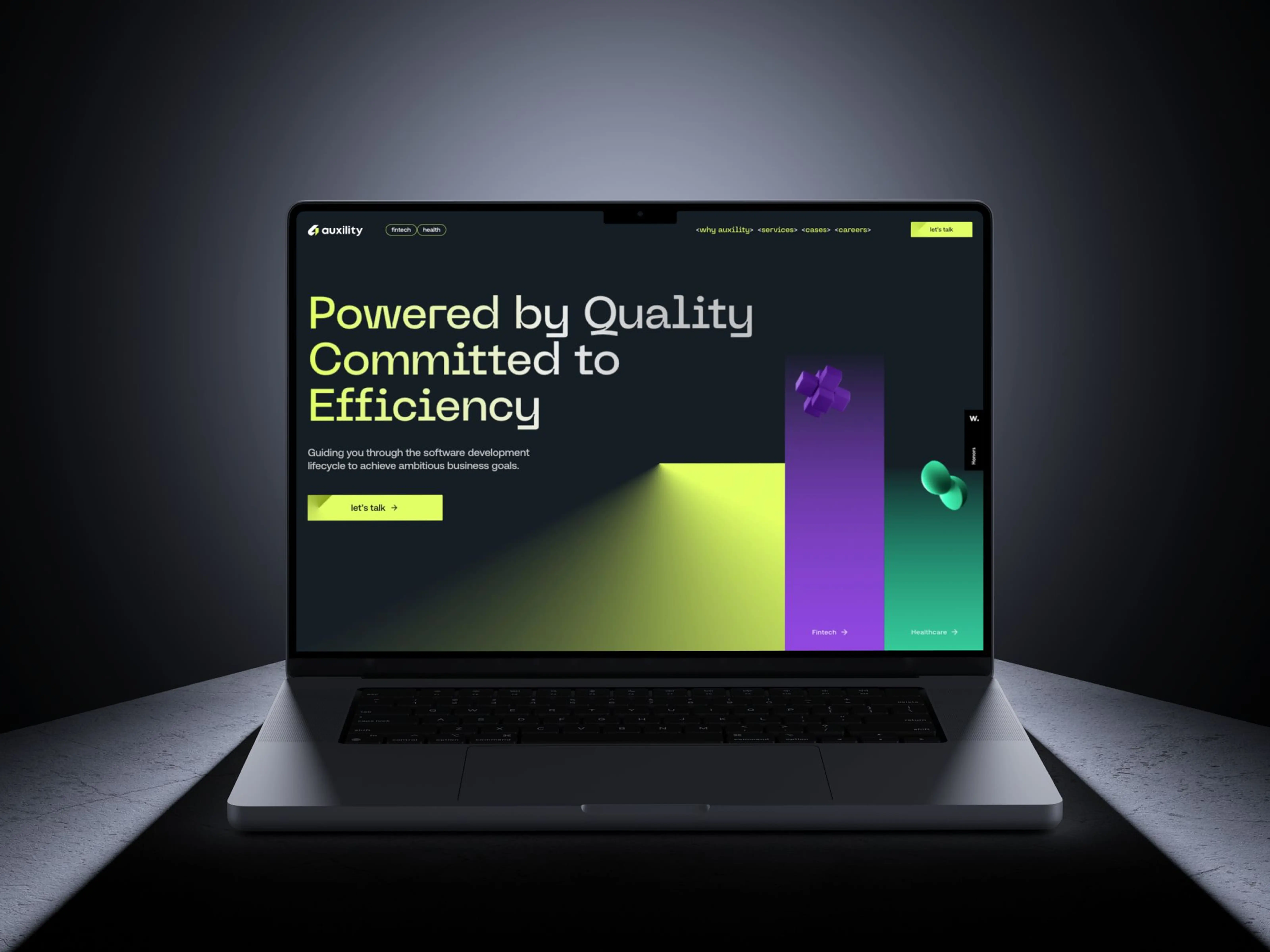 A laptop with a website developed by our team, Auxility, displayed on the screen