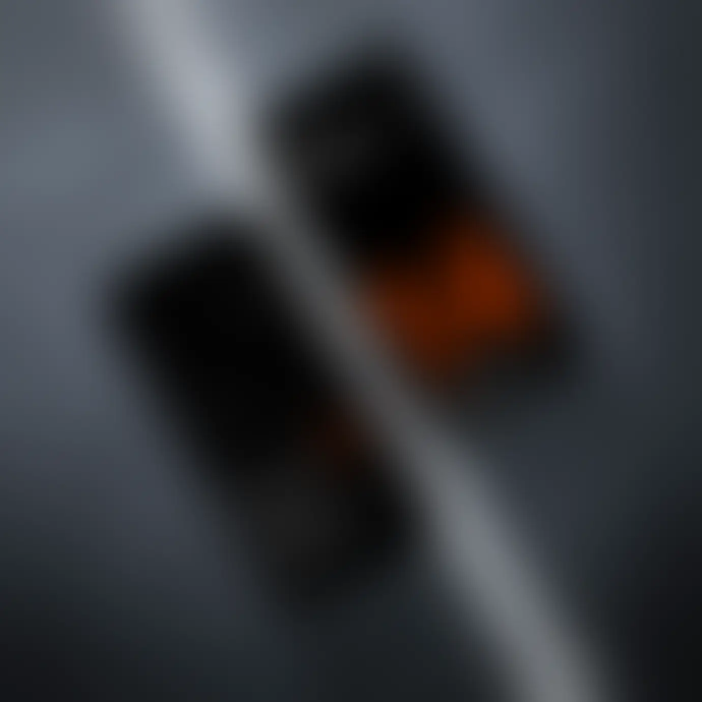 A couple of cell phones sitting next to each other, with the CODE Furniture website open on their screens.