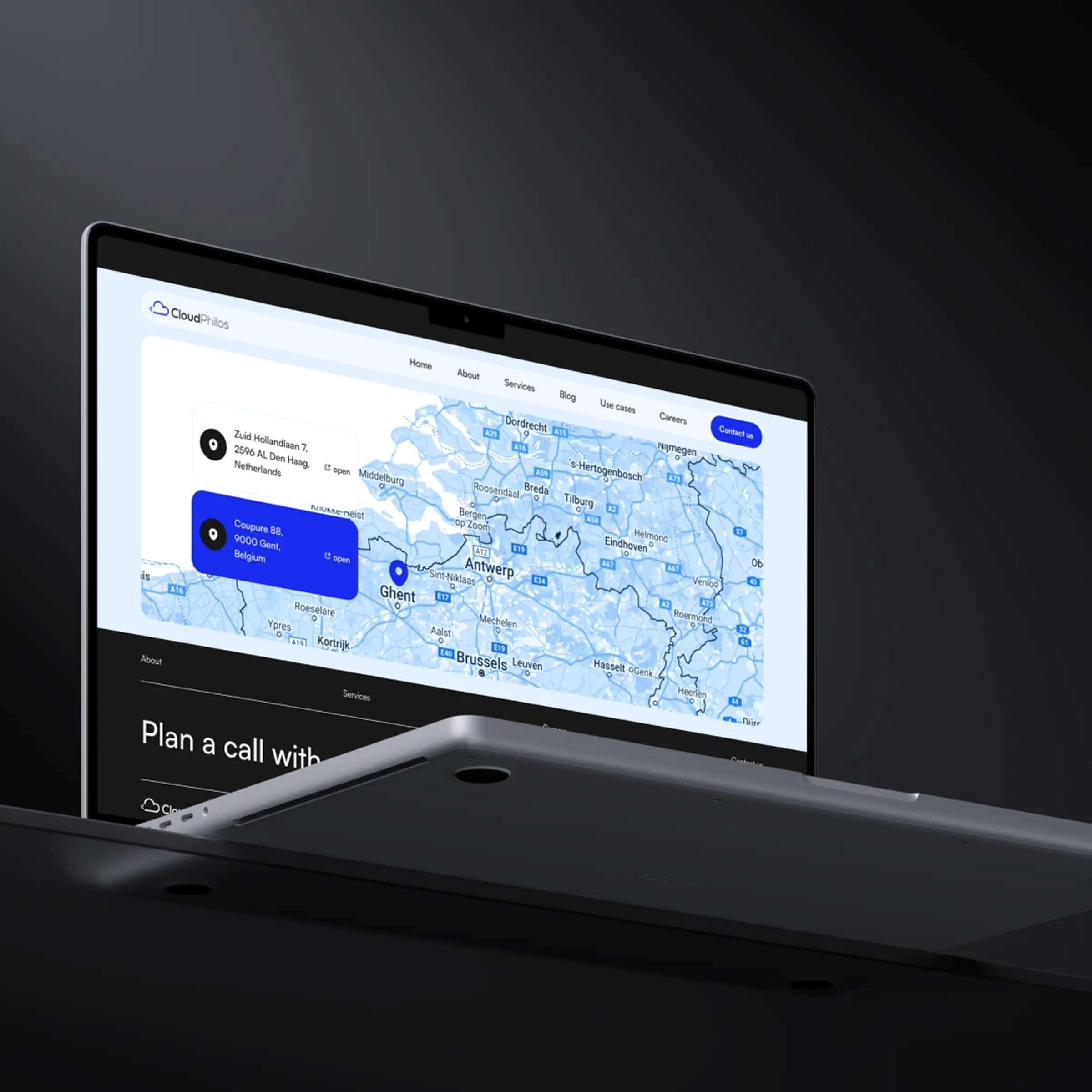 Laptop displaying CloudPhilos corporate website, showing a blue-tinted map of Belgium and the Netherlands with marked office locations, representing the company’s cloud infrastructure consulting services.