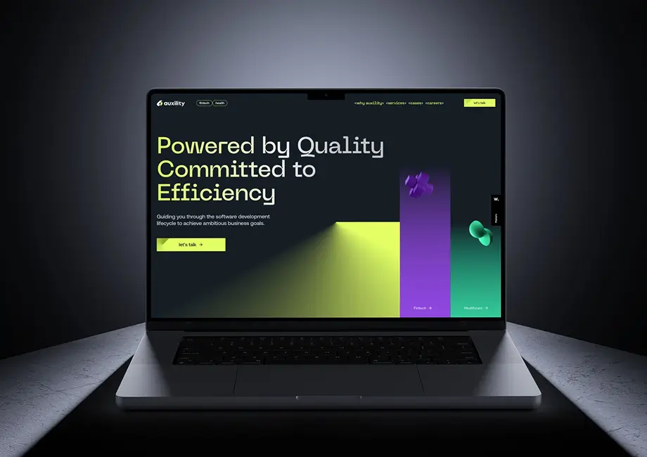 A laptop with a website developed by our team, Auxility, displayed on the screen