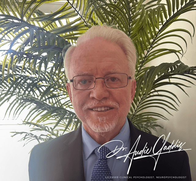 "Dr. Audie Gaddis, PhD, licensed psychologist and neuropsychologist, smiles in a professional portrait, showcasing his role in offering compassionate, evidence-based mental health services, particularly through telehealth."