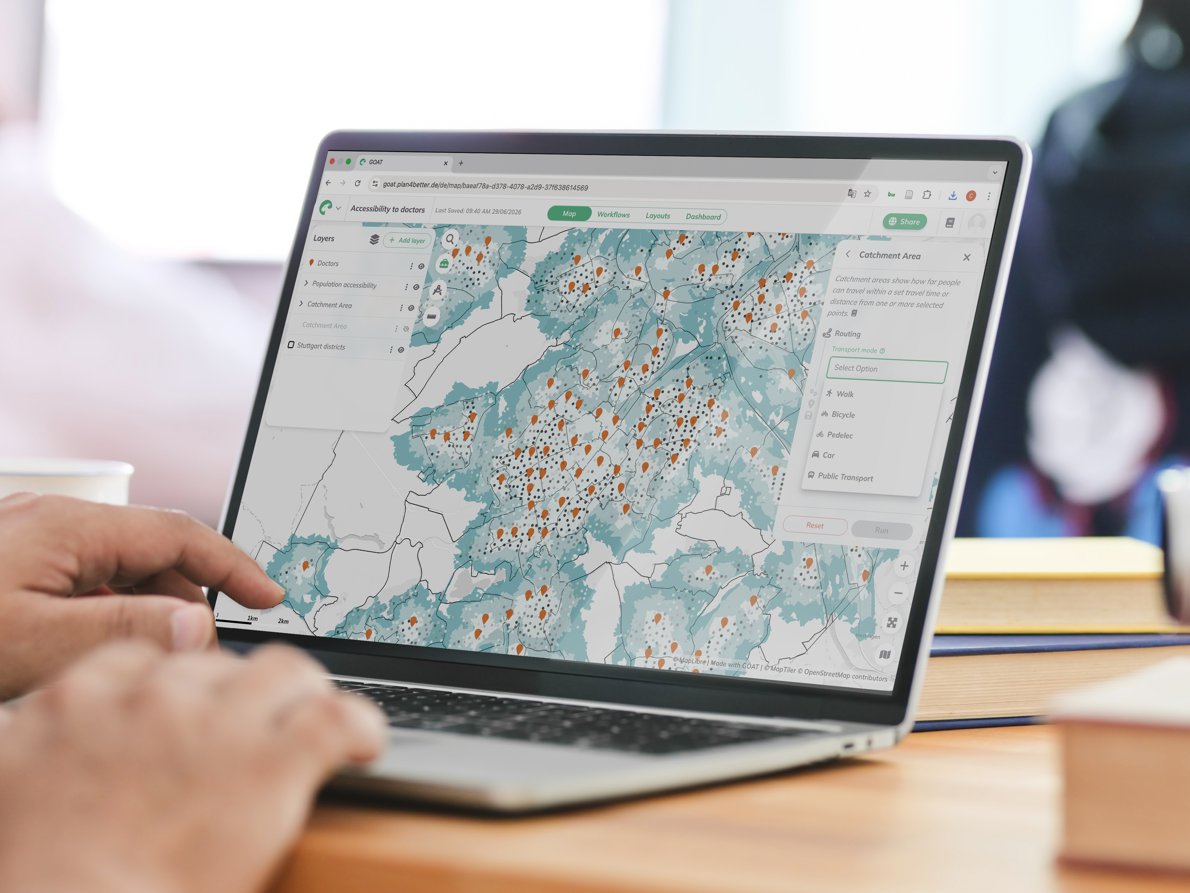 A planner working in GOAT on a laptop