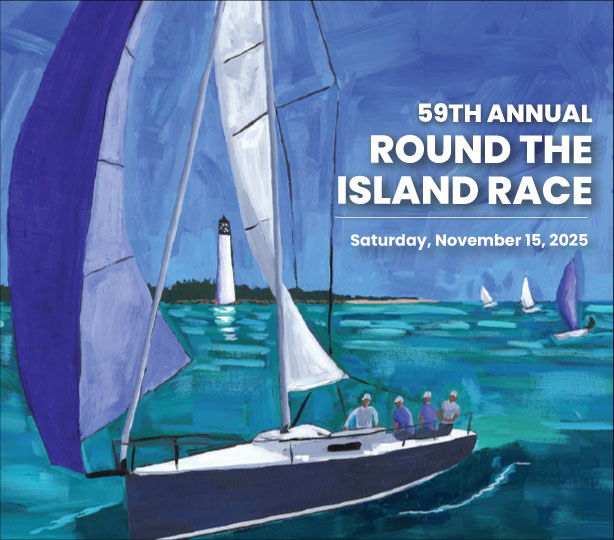 Multiple sailing yacht approach a race start line