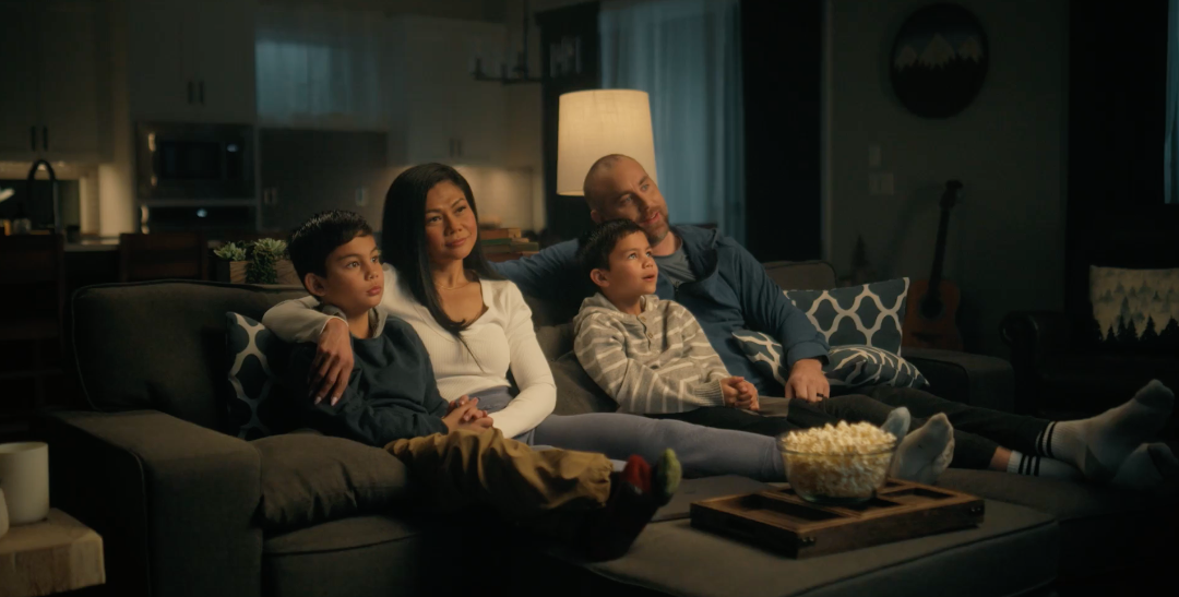 Family on a couch in the Wayfinder commercial by Reverb Films