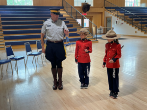 Two 10 year olds get lifetime experience as co-commanding officers of the RCMP Depot Division