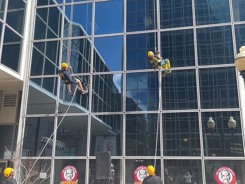 Dozens rappel down Regina’s Hill Tower II to support SaskAbilities