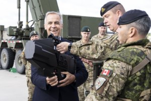 Carney tours Latvian military base to wrap up European trip