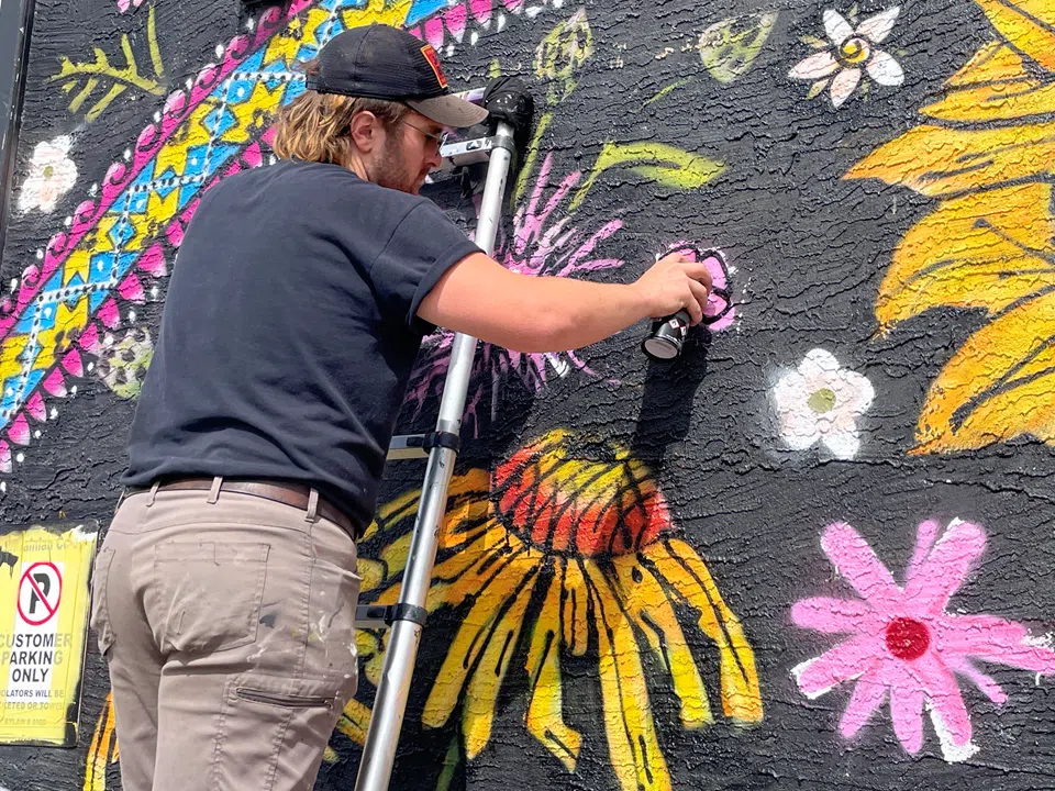 Artist updates mural with a fresh look